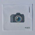 Hand painted needlepoint canvas depicting a camera on 18 mesh 